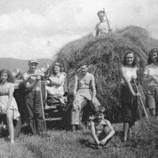 Many children in the valley worked for farmer and Rockwell model Jim Edgerton (on top of hay) at one time or another. His daughter and model Ardis Edgerton Clark, far left, wrote letters to Art Becktoft (young man in the middle) when Art’s fighter plane was shot down over Germany during WWII. After Art returned to Vermont from P.O.W. camp, Norman used him as a model for 1945 Saturday Post cover, as a young man happy to be home from war. Also, little Billy Brown sits in front of the group. Norman loved Billy’s lively spirit and used him for Going and Coming as the boy who has stuck his upper out the window. Photo courtesy of Ardis Edgerton Clark.