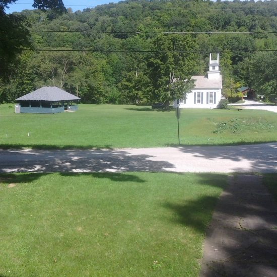 From inside their home, the Rockwells had a view of the dance pavilion, 1802 church, and the covered bridge on the Village Green.